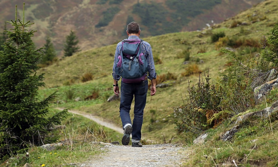 a hiker with a backpack and hiking boots